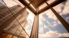 beautiful view out a golden window of clouds and skyscrapers